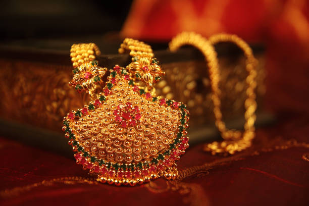 Traditional Aspire- Traditional Fashion Jewelry featuring ornate antique gold necklace with colorful semi-precious stones.