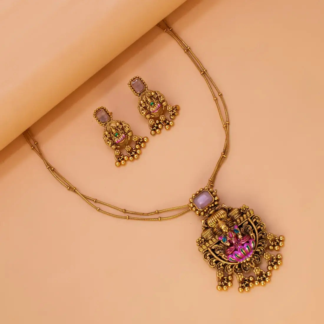 Pink Stone Antique Lakshmi Pendant Necklace Set featuring intricate design and gungroo danglers.