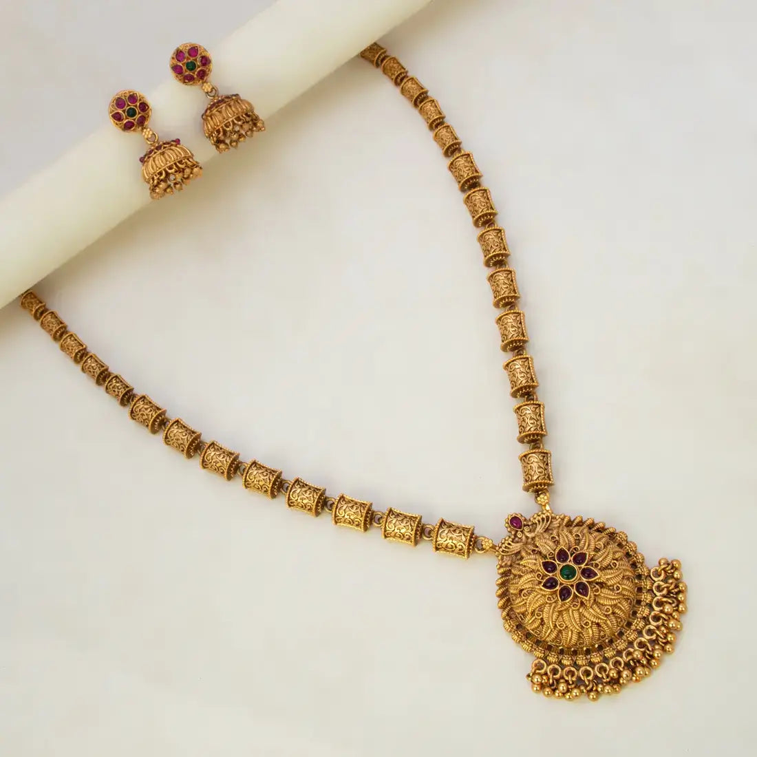 Antique Temple Floral Kemp Stone Long Chain Set featuring a large Kemp pendant and ornate jhumka earrings.