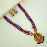 Antique Gold Lakshmi Pendant Beaded Long Necklace Set with purple beads and jhumka earrings.