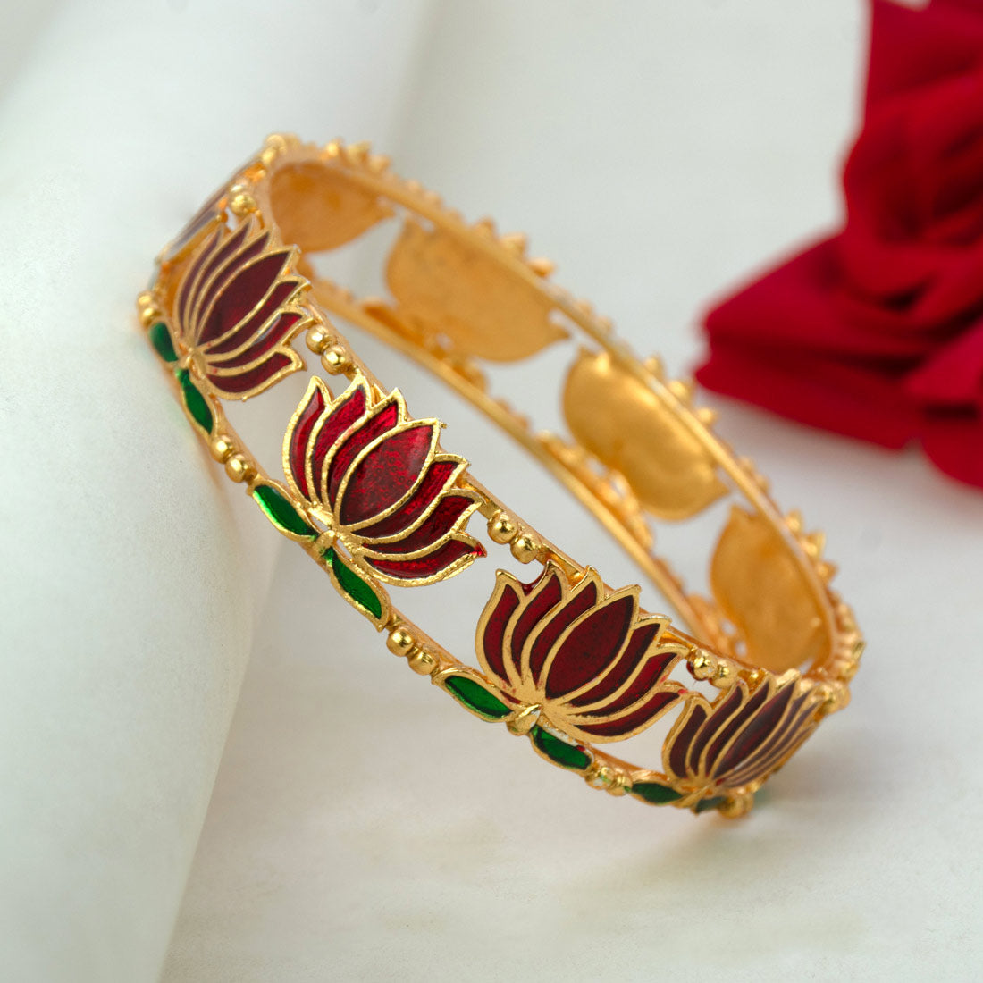 Matte Gold Plated Lotus Enamel Bangle with intricate lotus motifs and rich enamel detailing.