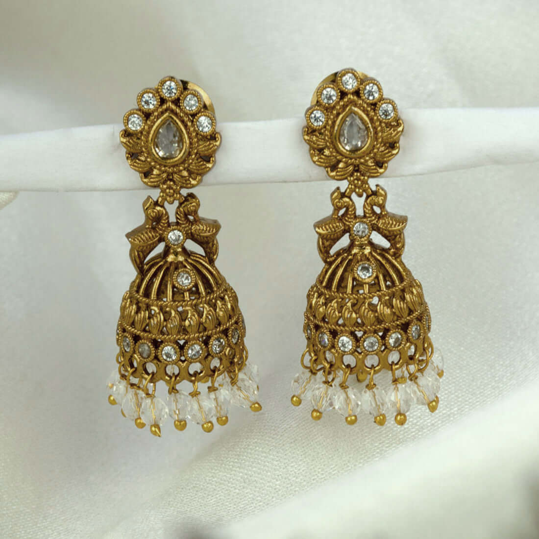 Small Antique Gold Plated Twin Peacock Stone Jhumkas with intricate design and dangling beads.