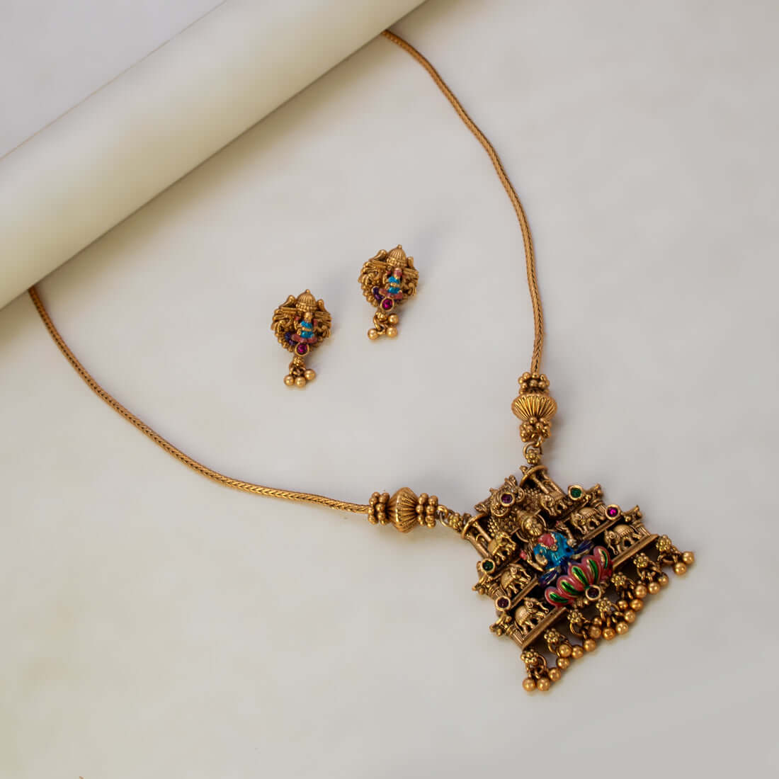 Antique Lakshmi Elephant Temple Pendant Necklace Set featuring intricately designed pendant and matching earrings.