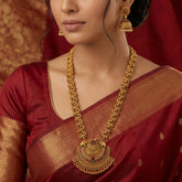 Antique Peacock Kemp Stone Long Chain Set worn with a traditional red saree featuring intricate gold detailing.
