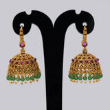 Antique Gold Ruby Red Kemp Stone Jhumka Earrings showcasing intricate details and vibrant colors.