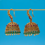 Antique Gold Ruby Red Kemp Stone Jhumka Earrings featuring ruby and green stones with intricate gold detailing.