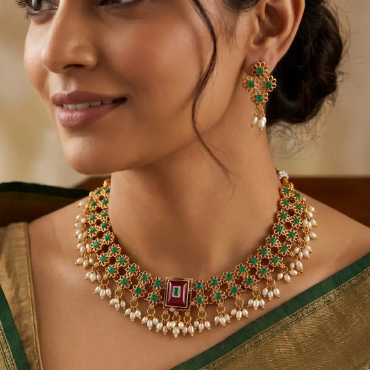Antique White Pearls Hanging Stone Necklace Set worn by a model with matching earrings and elegant outfit.