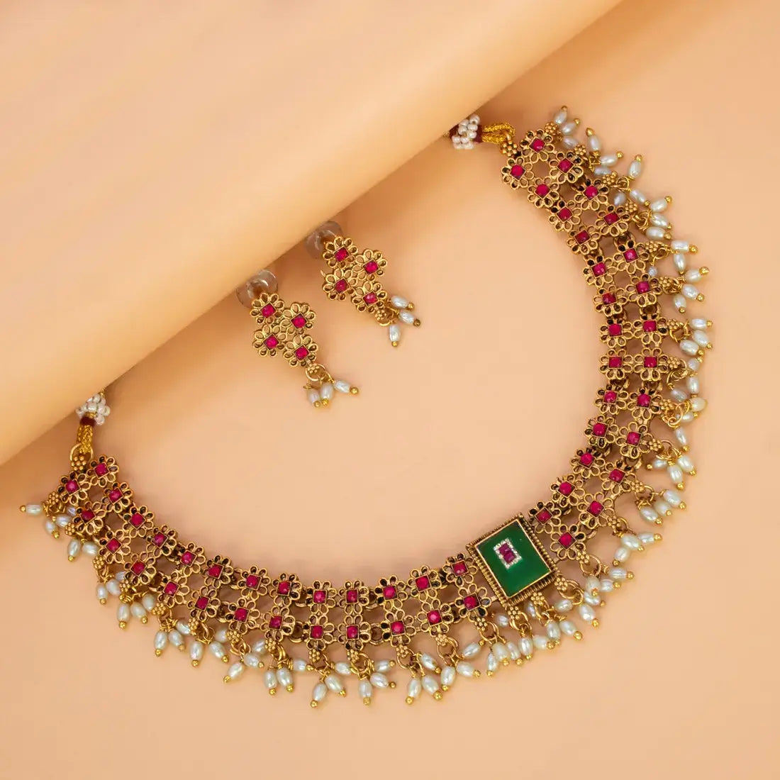 Antique White Pearls Hanging Stone Necklace Set with intricate gold detailing and matching earrings