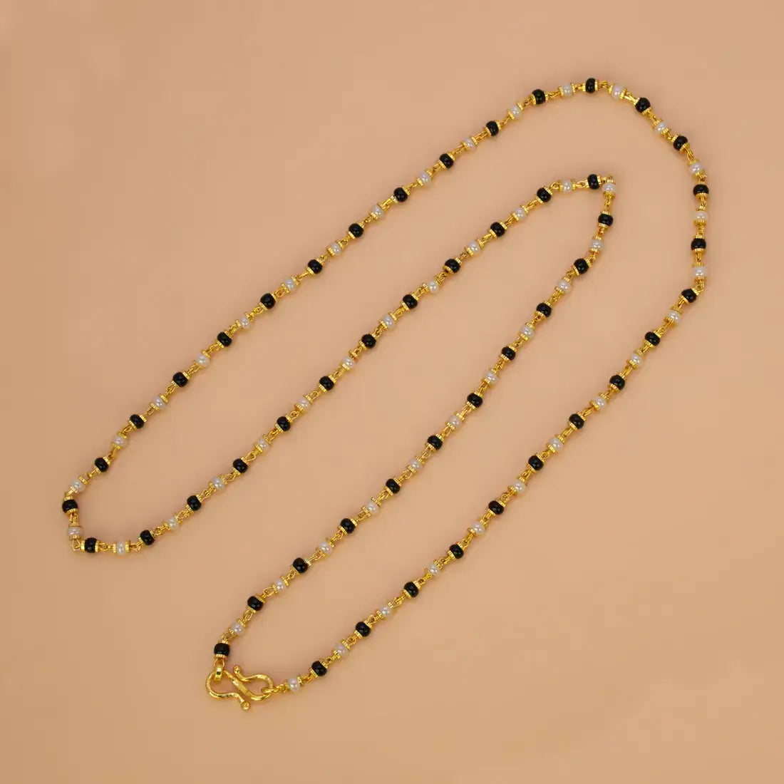 Gold Plated Black and White Pearl Chain Necklace for Women on a light background.
