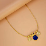 Green Enamel Gold Plated Lakshmi Kasu Necklace featuring gold coins and a blue stone pendant.