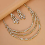American Diamond necklace and earrings on a peach background