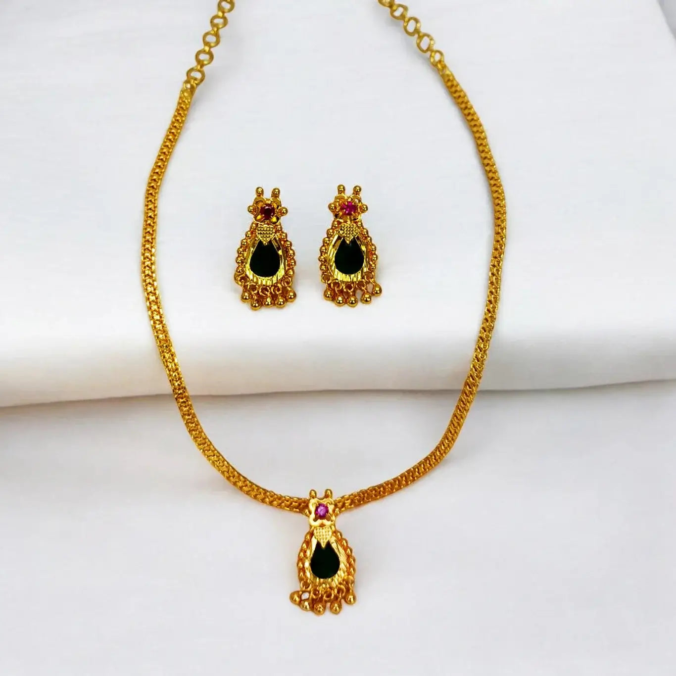 Elegant Gold Plated Green Nagapadam Pendant Set featuring a necklace and matching earrings.