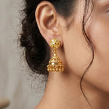 Gold-Plated Small Floral Jhumka Earrings showcasing a floral stud top and cascading polished gold ball drops.