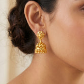 Gold-Plated Small Floral Jhumka earrings showcased on a woman, highlighting traditional Indian craftsmanship.