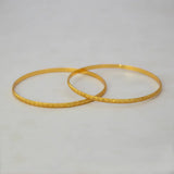 Lightweight Gold Plated Indian Bangles for Women displayed on a neutral background, featuring simple diamond-cut designs.