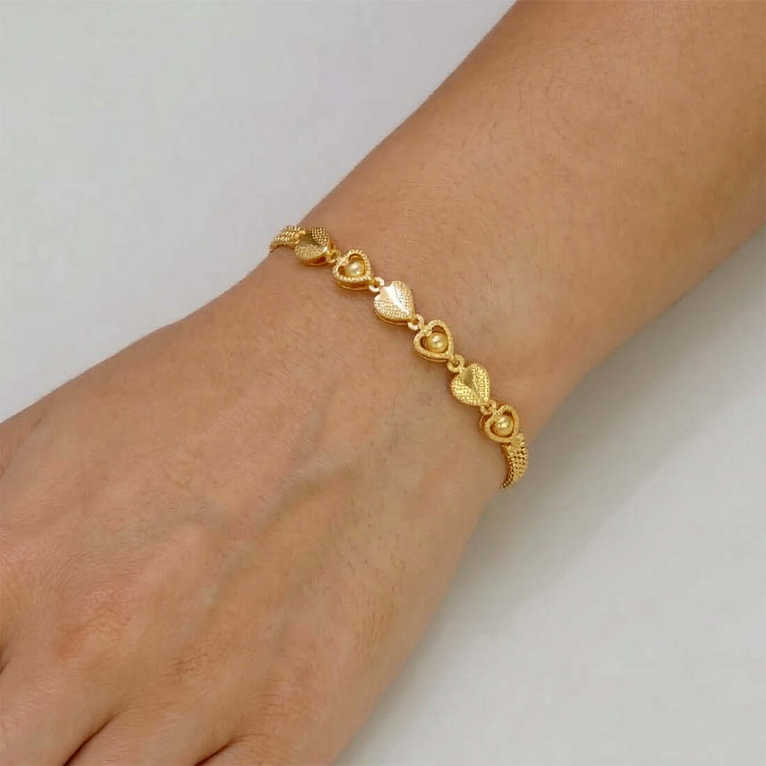 Gold PlatedĀ Triple Ball Heart Kilukkam Bracelet