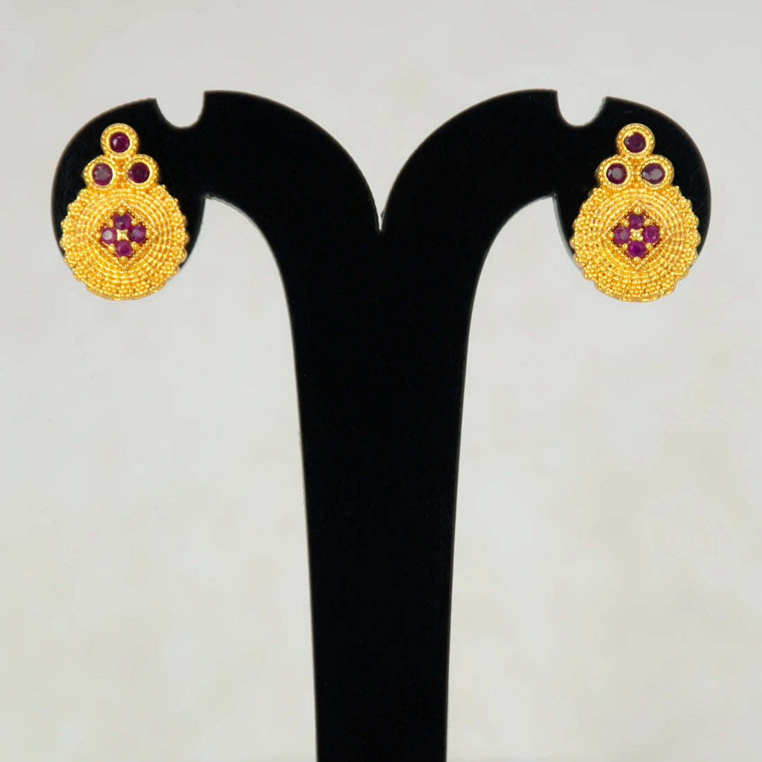 Gold Plated Floral Stone Studded Earrings-Ruby