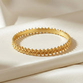 Gold Plated Two Line Designer Bangles on a luxurious fabric background, perfect for daily wear bangles.