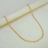 Stylish Gold Plated Cutting Bhanu Priya Chain displayed on a smooth surface, showcasing its elegant design and shine.