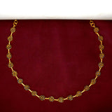 Marvelous Gold Plated Round Stone Necklace displayed against a maroon background, showcasing its dazzling design.
