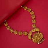 Matte Nagas Peacock Lakshmi Temple Necklace showcasing intricate deity links and centerpiece on a red background.