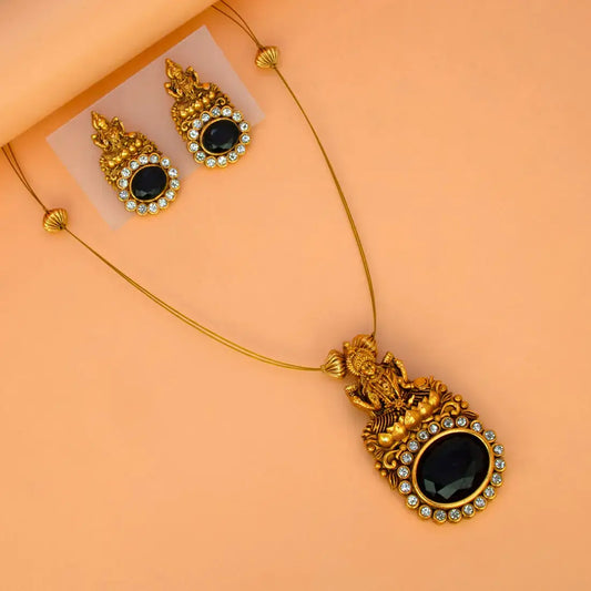 Gorgeous Matte Lakshmi Black CZ Pendant Set featuring a Lakshmi motif and black CZ stones on a gold chain.