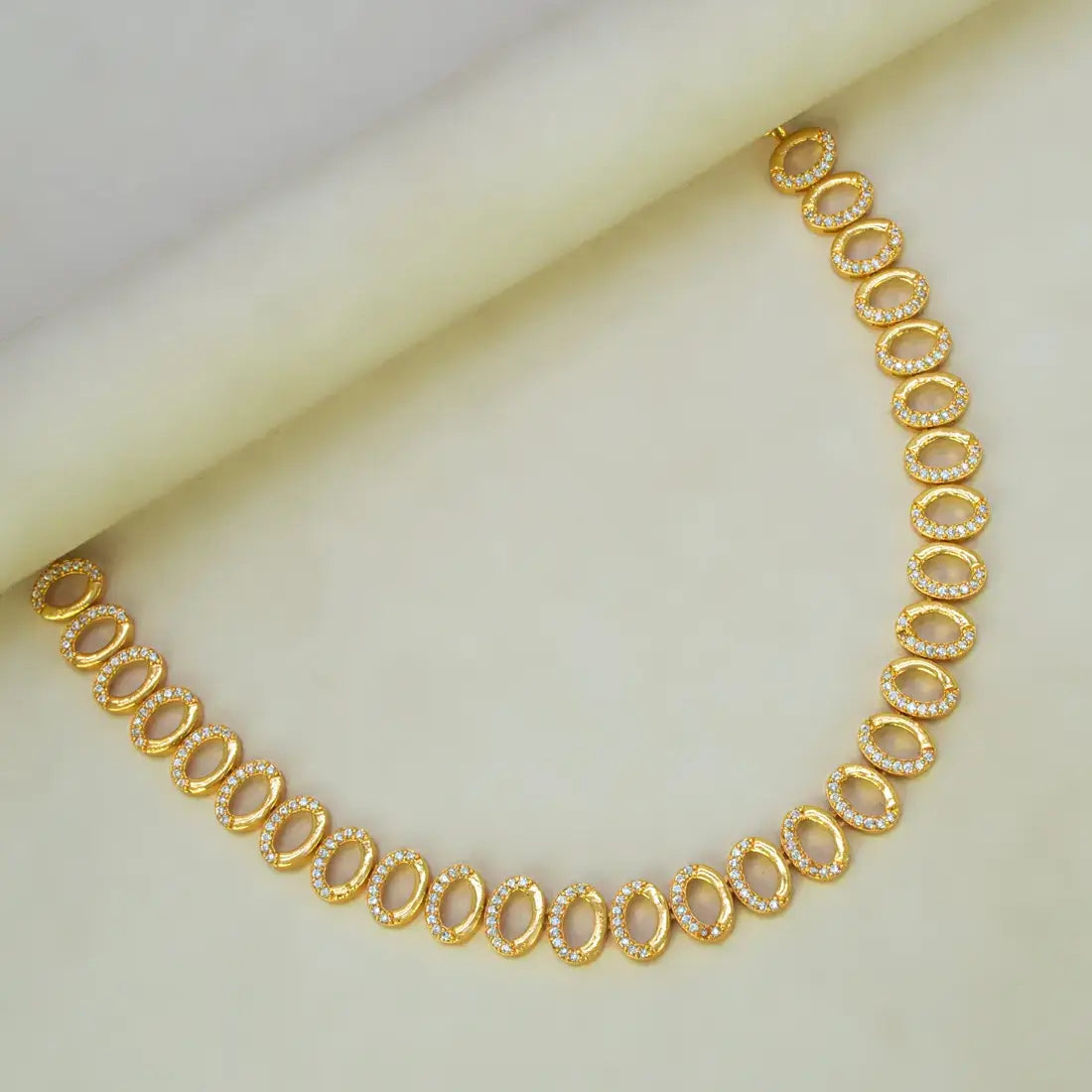 Gold Plated Oval CZ Stone Necklace featuring sparkling cubic zirconia in a gold finish.