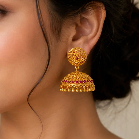 Premium Gold Plated Filigree Ruby Stone Umbrella Jhumka Earrings worn by a woman, showcasing their elegant design.
