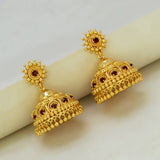 Red Stone Gold Plated Big Jhumka Earrings showcasing intricate design with deep red stones and decorative sunburst stud.