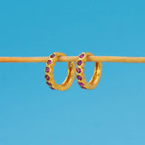 Gold Plated Stone Hoop Earrings for Women featuring purple stones set in a sleek gold finish.