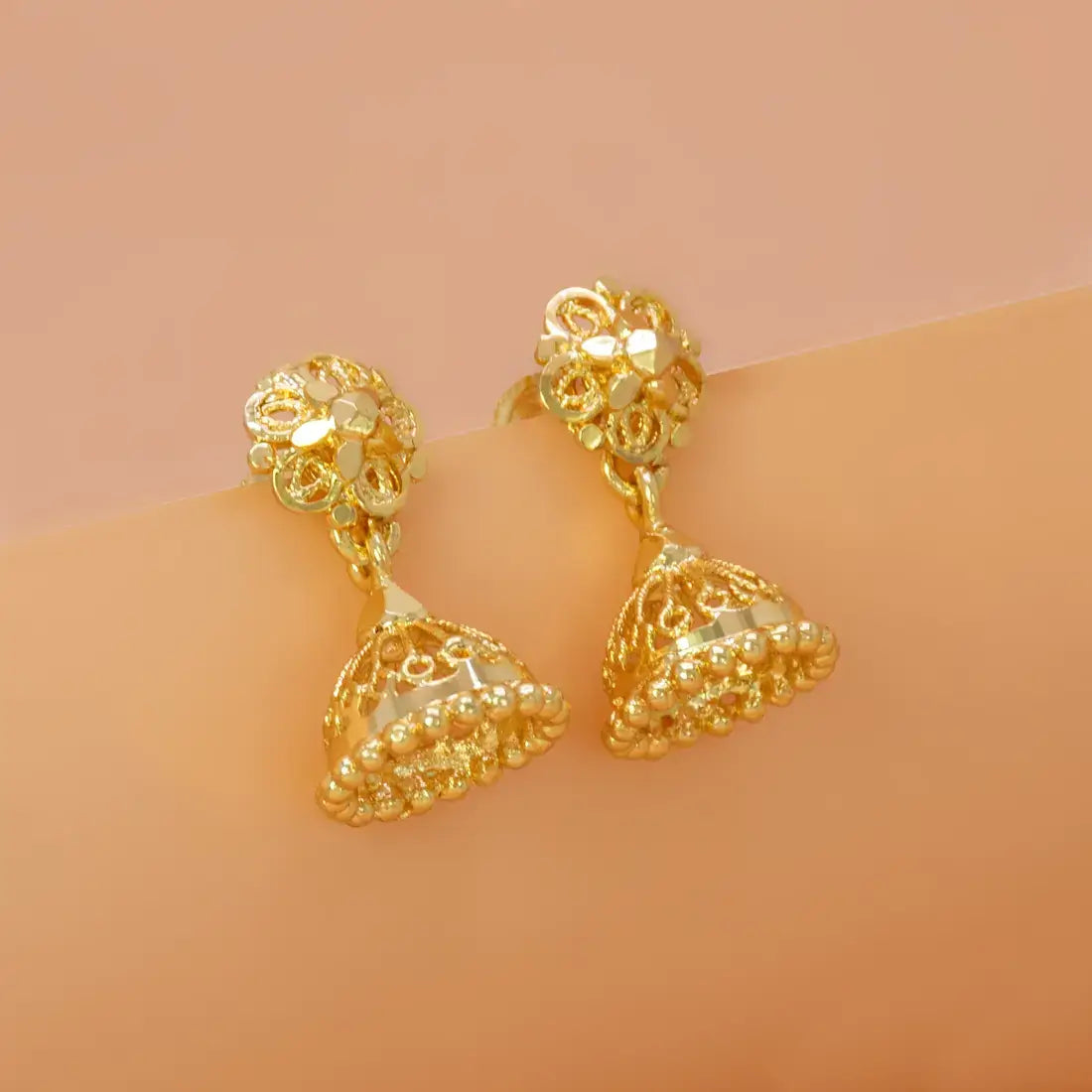 Simple Gold Foamed Jhumka Earrings showcasing delicate filigree details and a lightweight design, perfect for daily wear.