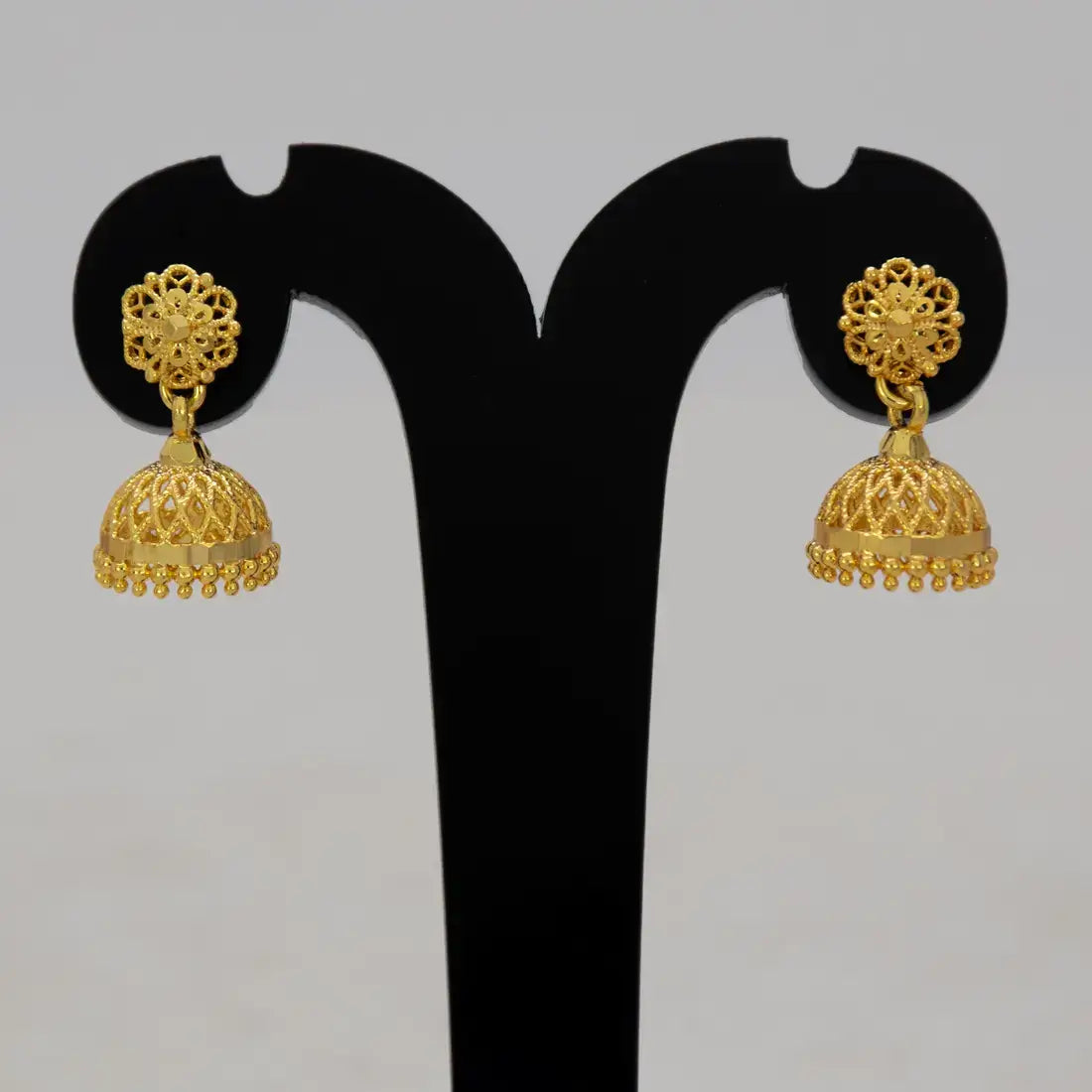 Net Design Gold Plated Filigree Jhumka Earrings showcasing intricate craftsmanship and traditional elegance.