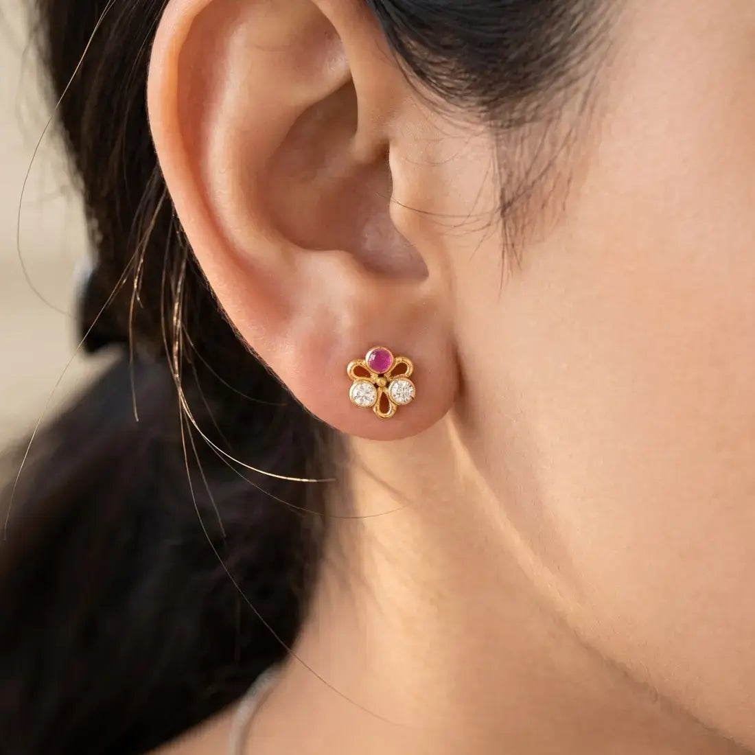 Simple Stone Flower Studs for Second Lobe & Kids worn in ear, featuring gold outline and sparkling stones.