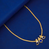 Simple Three Petal Gold Plated Mango Necklace with blue mango CZ stones and round pendant on a blue background.