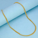 Stylish Gold Plated Unisex Thin Curb Link Chain displayed on a light blue background.