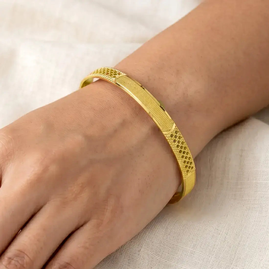 Exquisite Textured Mesh Design Kada Bangle worn on a wrist, showcasing intricate filigree mesh work.