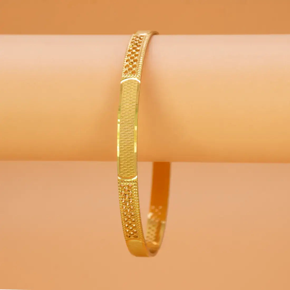 Exquisite Textured Mesh Design Kada Bangle showcasing intricate gold detailing on a smooth background.