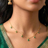 Gold-plated necklace with small Emerald Green stone pendants