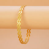 Unique Gold Plated Zigzag Bangles displayed on a neutral background, showcasing the undulating wave form and micro-bead texture.
