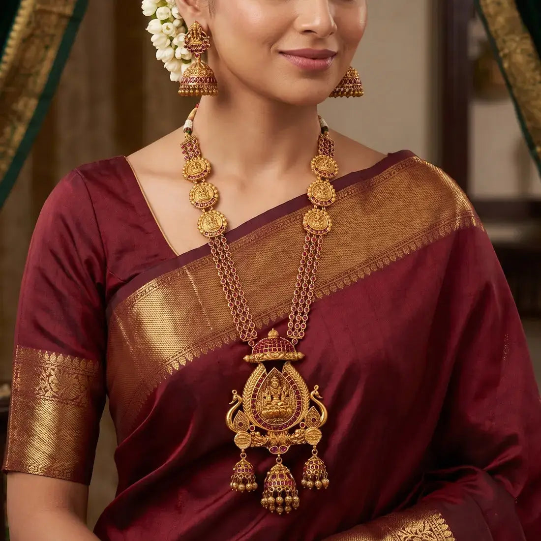 Antique Kemp Lakshmi Temple Long Necklace Set worn with matching jhumkas, perfect for weddings and festive occasions.