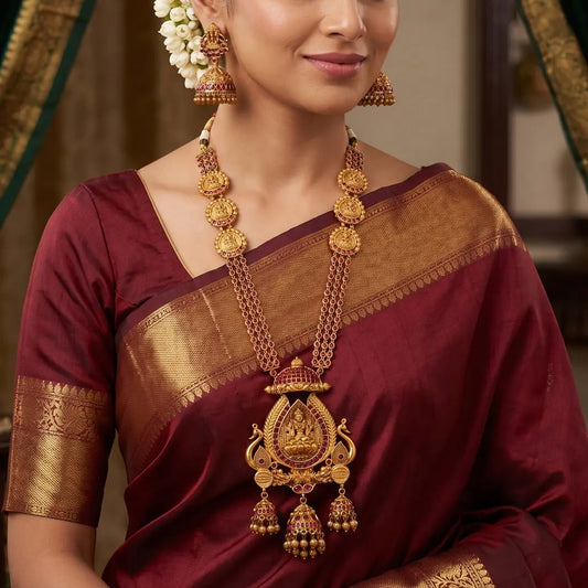 Antique Kemp Lakshmi Temple Long Necklace Set worn with matching jhumkas, perfect for weddings and festive occasions.