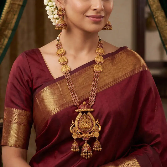 Antique Kemp Lakshmi Temple Long Necklace Set worn with matching jhumkas, perfect for weddings and festive occasions.