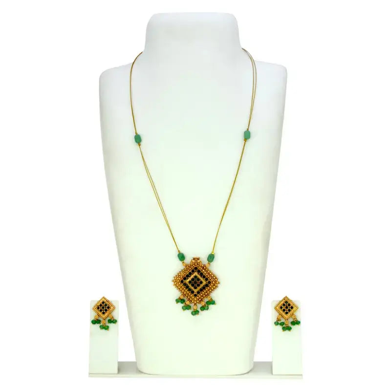 Fashion Invisible Chain Antique Green Stone Pendant Set displayed with matching earrings on a jewelry stand.