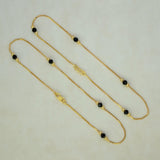 K Supreme gold plated brass anklets with box chain, black crystals, and gold beads. S hook closure.