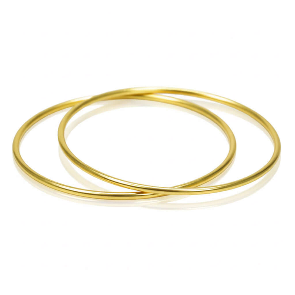 Gold Plated Thin Plain Bangles stacked on a white background, showcasing their sleek and minimalist design.