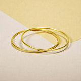 Gold Plated Thin Plain Bangles displayed on a minimalist background, showcasing their sleek design.