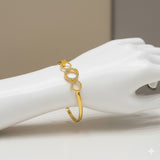Trendy Premium American Diamond Open Bangle displayed on a hand, featuring gold plating and interlinked circles.