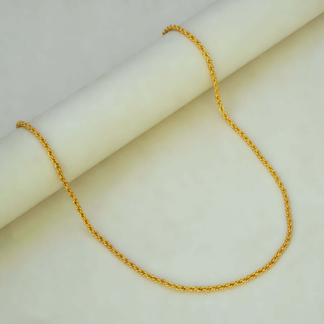 Gold Plated Coir Design Anjali Chain 24" displayed on a white surface, showcasing its elegant coir design.