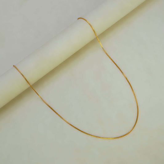 Aesthetic Gold Plated Thin Box Chain For Women displayed elegantly against a light background.