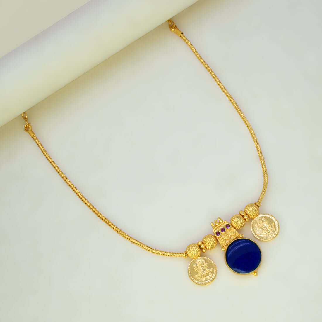 Green Enamel Gold Plated Lakshmi Kasu Necklace featuring a blue stone pendant and gold coins, perfect for traditional occasions.